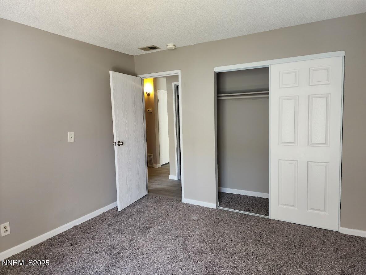 4604 Neil Road, Unit 142 Reno, NV 89502 - Photo 16 of 23 a view of an empty room with closet area