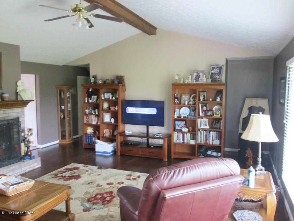 6849 Cedar Grove Road Shepherdsville, KY 40165 - Photo 18 of 28 Another view of the living room, fireplace, ceiling fan and vaulted ceiling