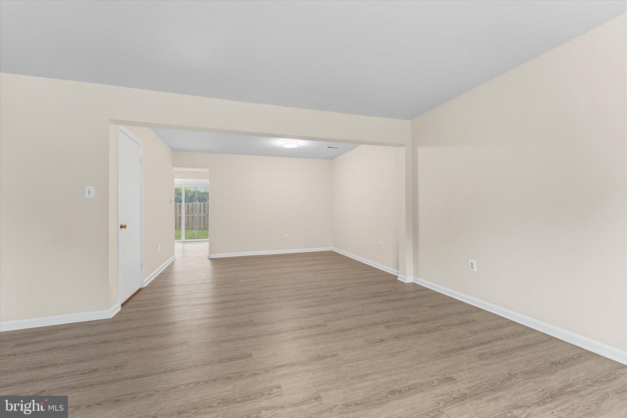 2753 Bixby Road Woodbridge, VA 22193 - Photo 8 of 22 a view of an empty room and wooden floor