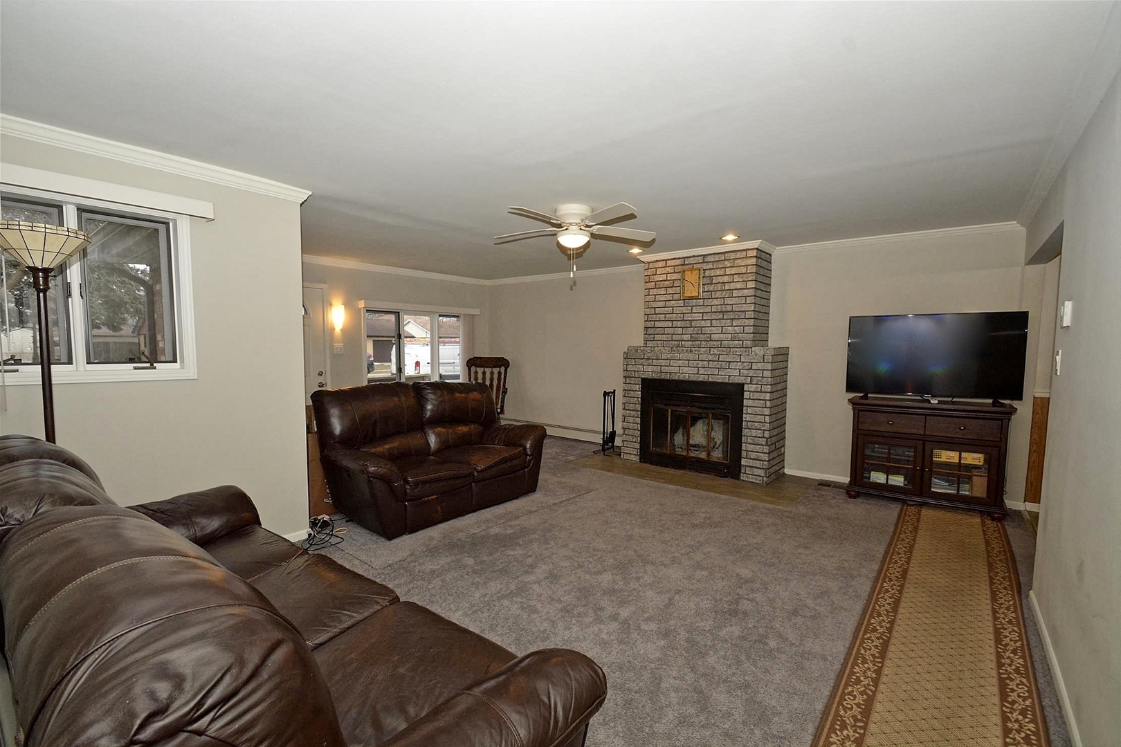 6138 Birmingham Street Chicago Ridge, IL 60415 - Photo 2 of 26 a living room with furniture and a flat screen tv