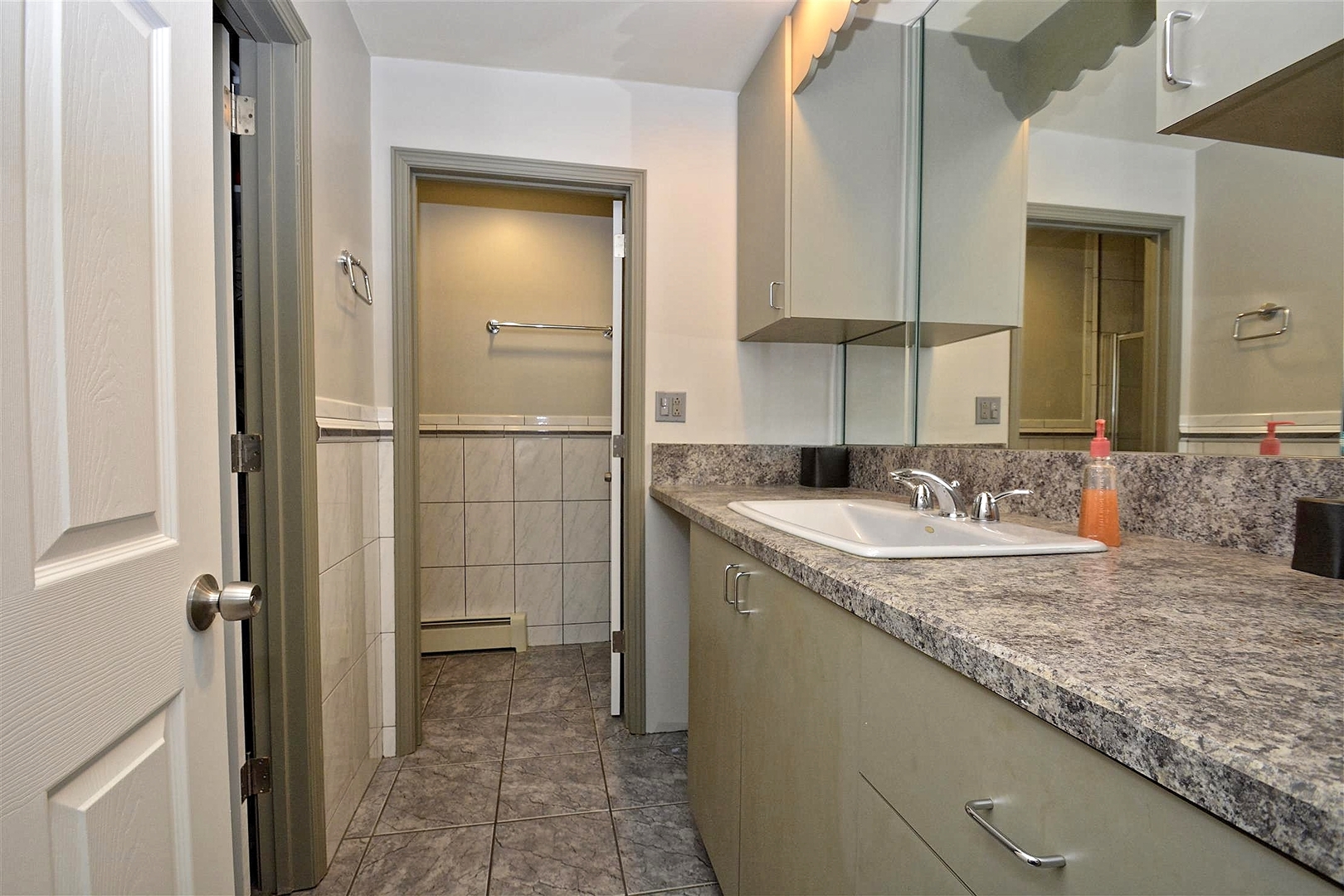 6138 Birmingham Street Chicago Ridge, IL 60415 - Photo 11 of 26 a bathroom with a granite countertop sink and a mirror