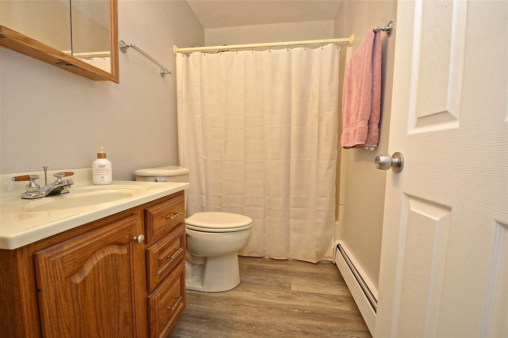 6138 Birmingham Street Chicago Ridge, IL 60415 - Photo 20 of 26 a bathroom with a sink a toilet and shower