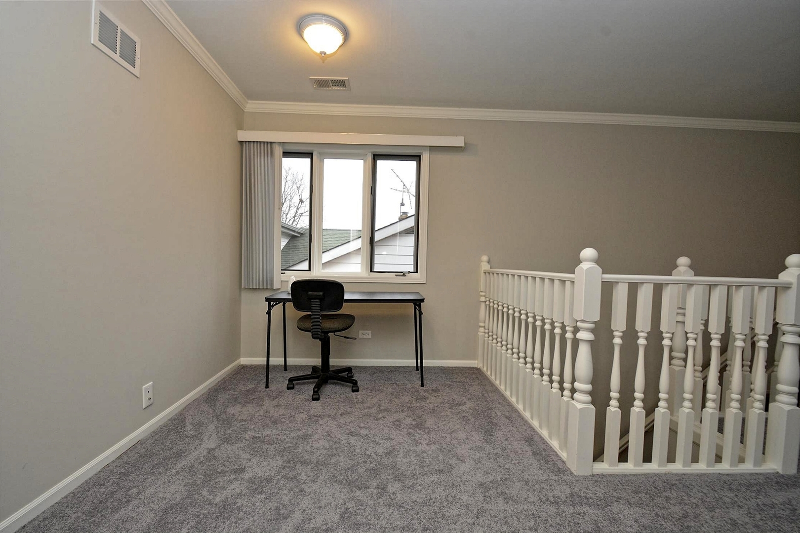 6138 Birmingham Street Chicago Ridge, IL 60415 - Photo 21 of 26 a view of a room with wooden floor and windows