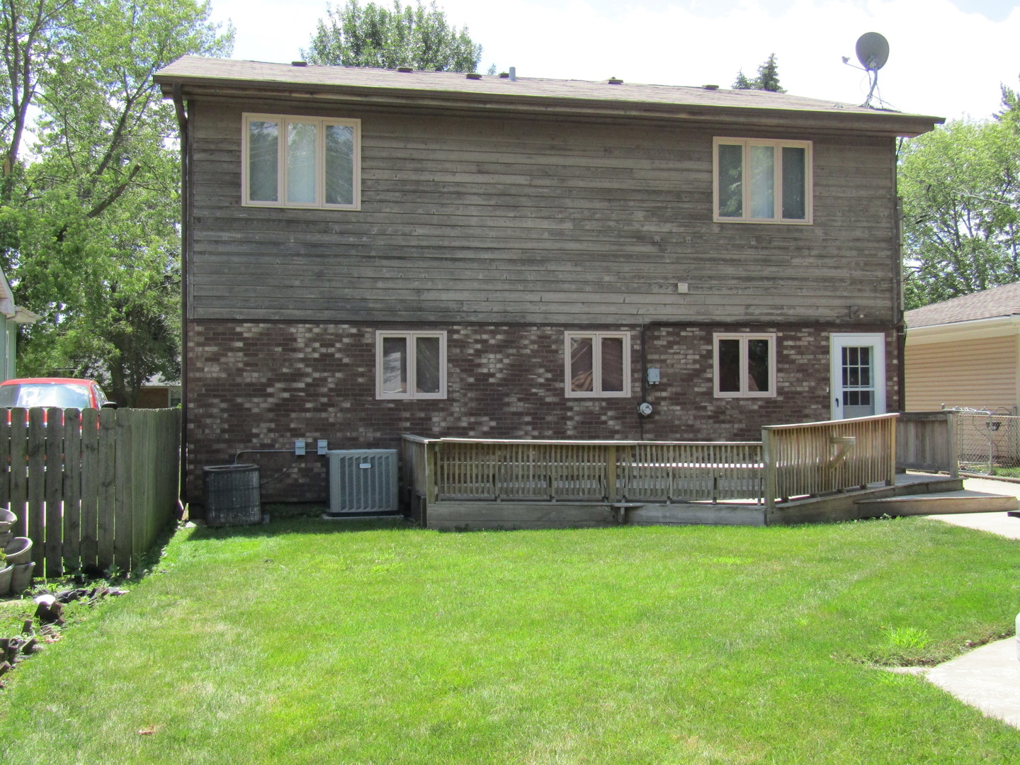 6138 Birmingham Street Chicago Ridge, IL 60415 - Photo 25 of 26 a front view of a house with a yard