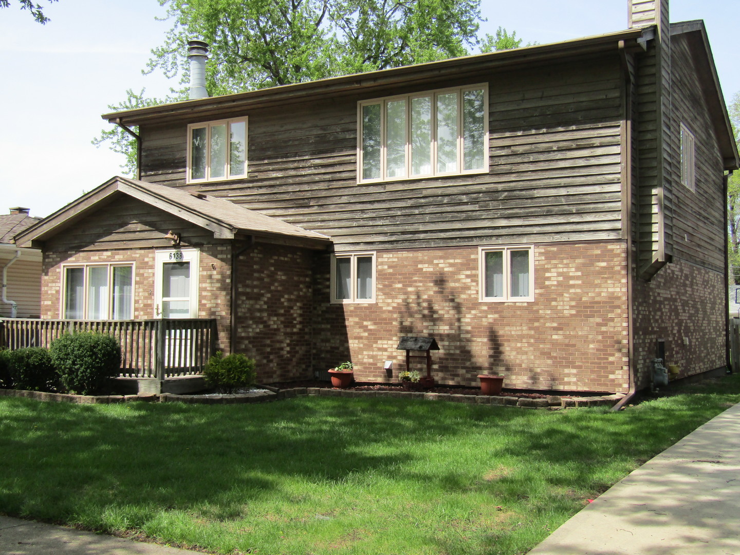 6138 Birmingham Street Chicago Ridge, IL 60415 - Photo 26 of 26 a front view of a house with a yard