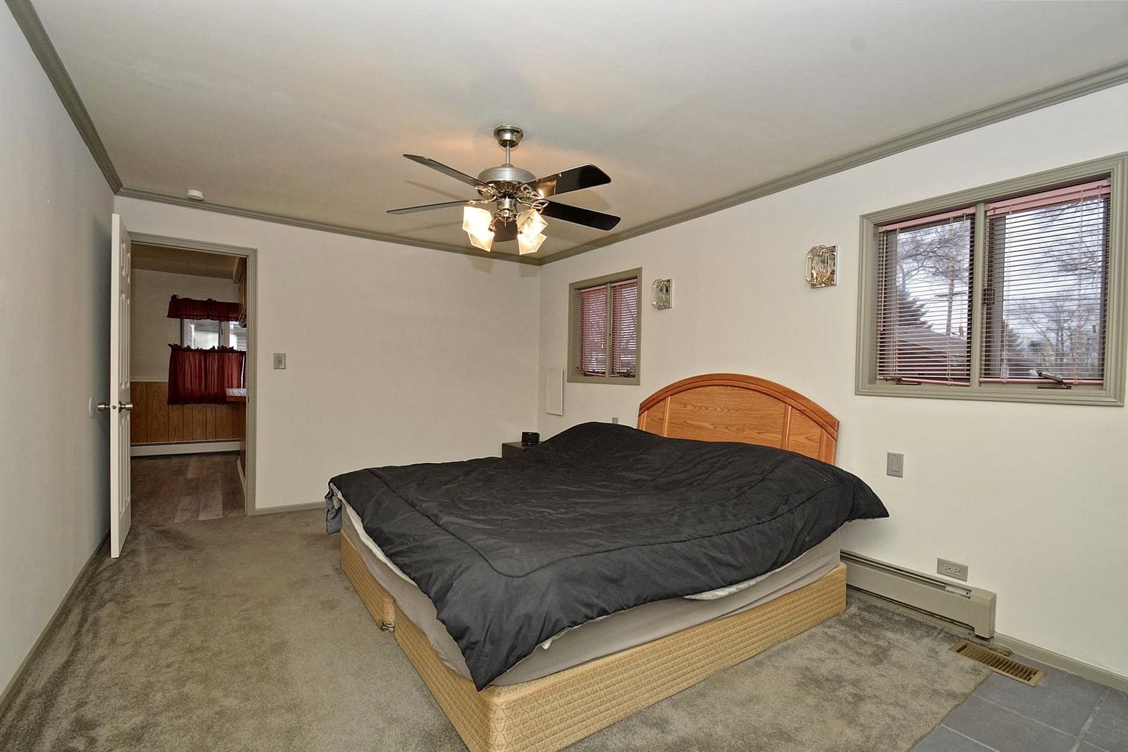 6138 Birmingham Street Chicago Ridge, IL 60415 - Photo 8 of 26 a spacious bedroom with a bed and a dresser
