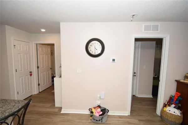 a view of an entryway with wooden floor