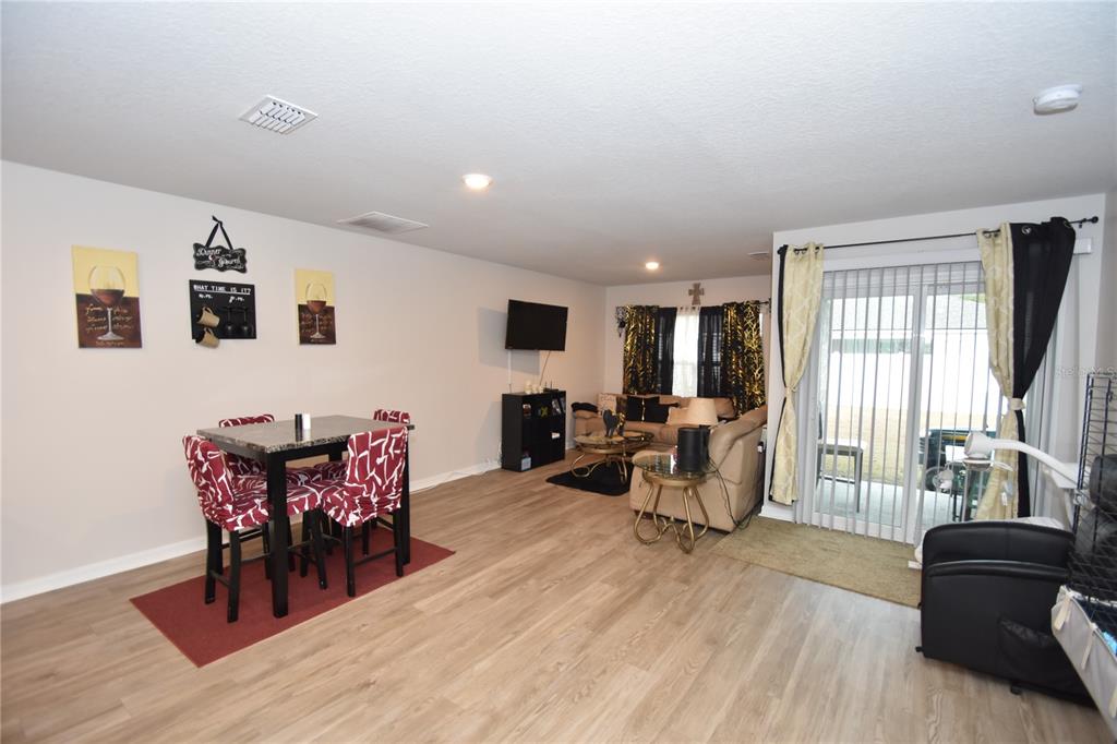 5 Rainstone Lane Palm Coast, FL 32164 - Photo 27 of 33 a living room with furniture and wooden floor
