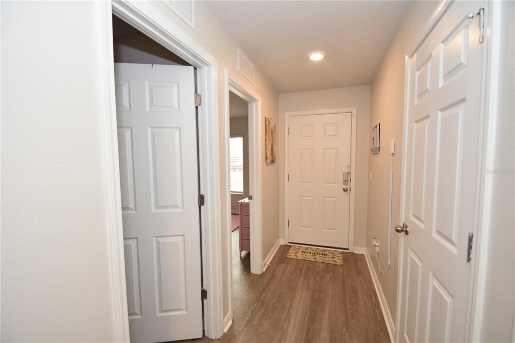5 Rainstone Lane Palm Coast, FL 32164 - Photo 31 of 33 a view of a hallway with wooden floor