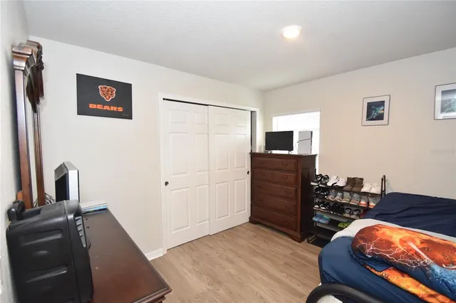 a view of a workspace with furniture and wooden floor