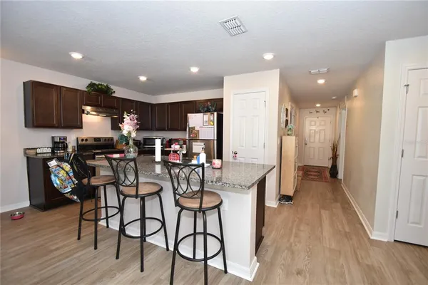 a view of a kitchen and dining area