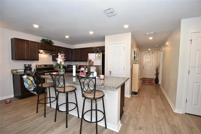 a view of a kitchen and dining area