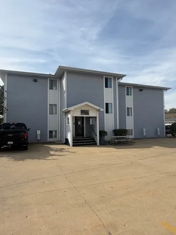 a house with trees in front of it