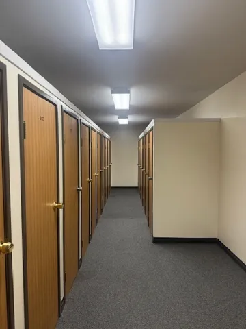 a view of storage and utility room with washer and dryer