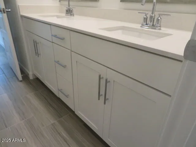 a close view of a sink and mirror in the kitchen