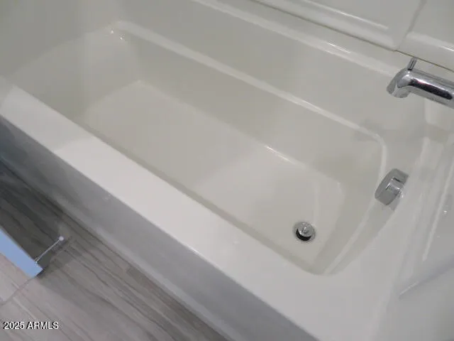 a view of a bathtub in a bathroom