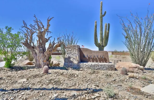 an aerial view of a house with swimming pool and lake view