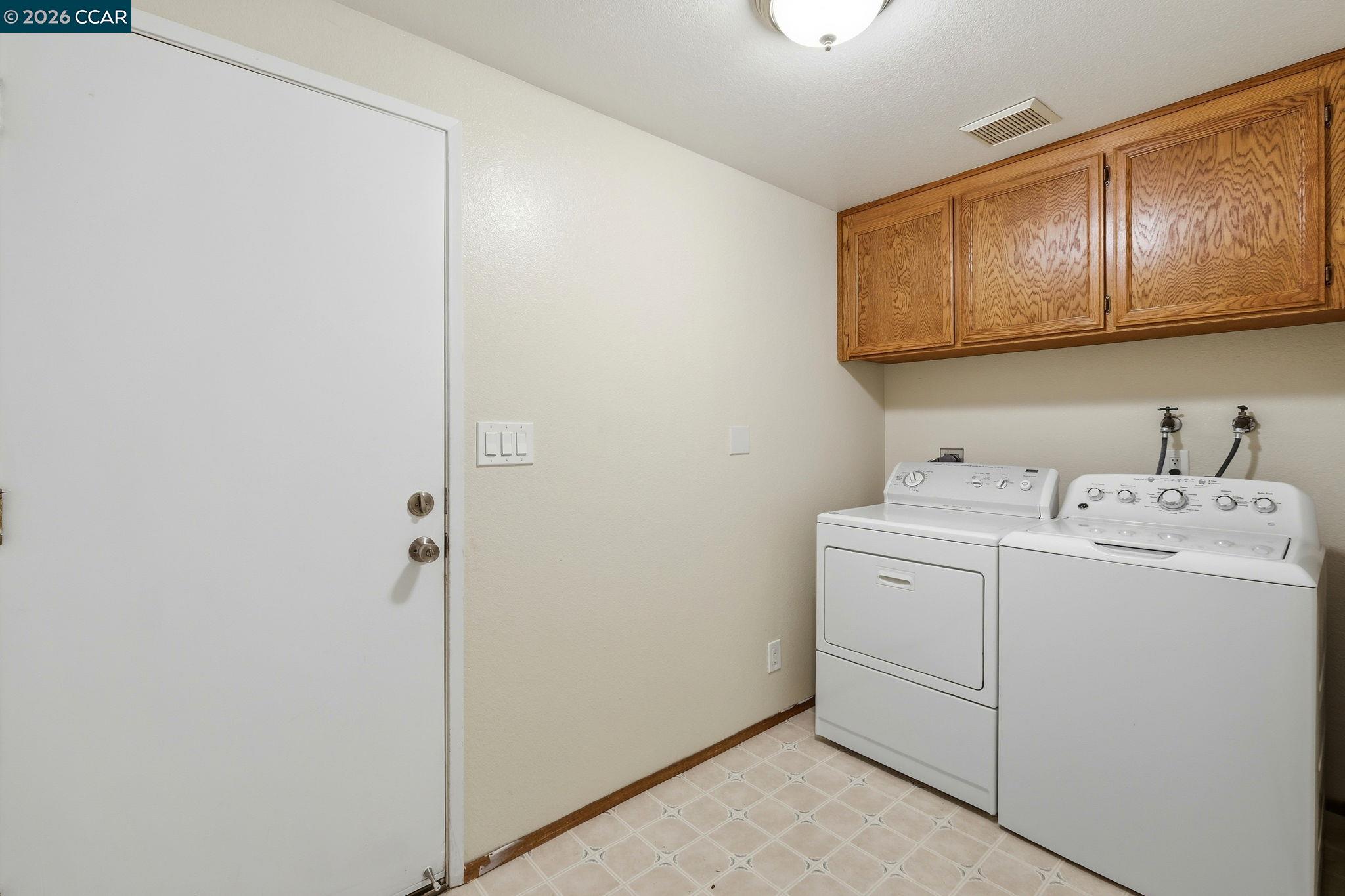 1707 Geary Road Walnut Creek, CA 94597 - Photo 35 of 43 a utility room with dryer and washer