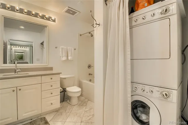 a view of a hallway with washer and dryer