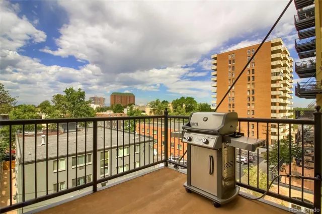 a view of balcony with furniture