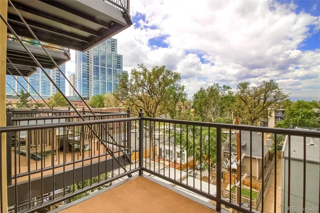 a view of balcony with wooden floor