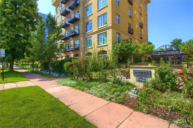 a view of a building with a yard