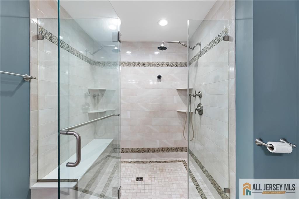 28 Garfield Way Princeton, NJ 08540 - Photo 6 of 39 a bathroom with a glass shower door