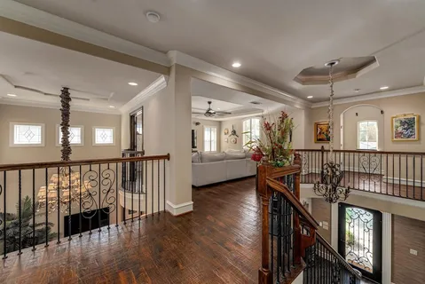 a view of entryway with wooden floor and windows