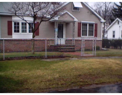 10 Bruce Street Springfield, MA 01119 - Photo 1 of 1 a front view of a house with a garden