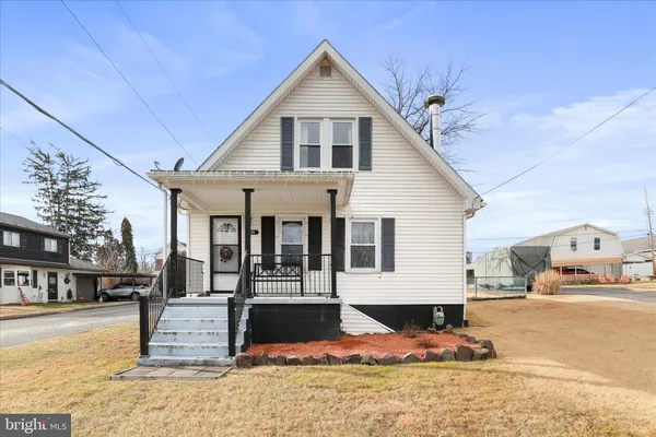 a view of a house with snow on the wall