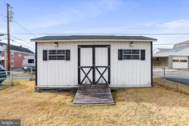 a view of a car park in front of house