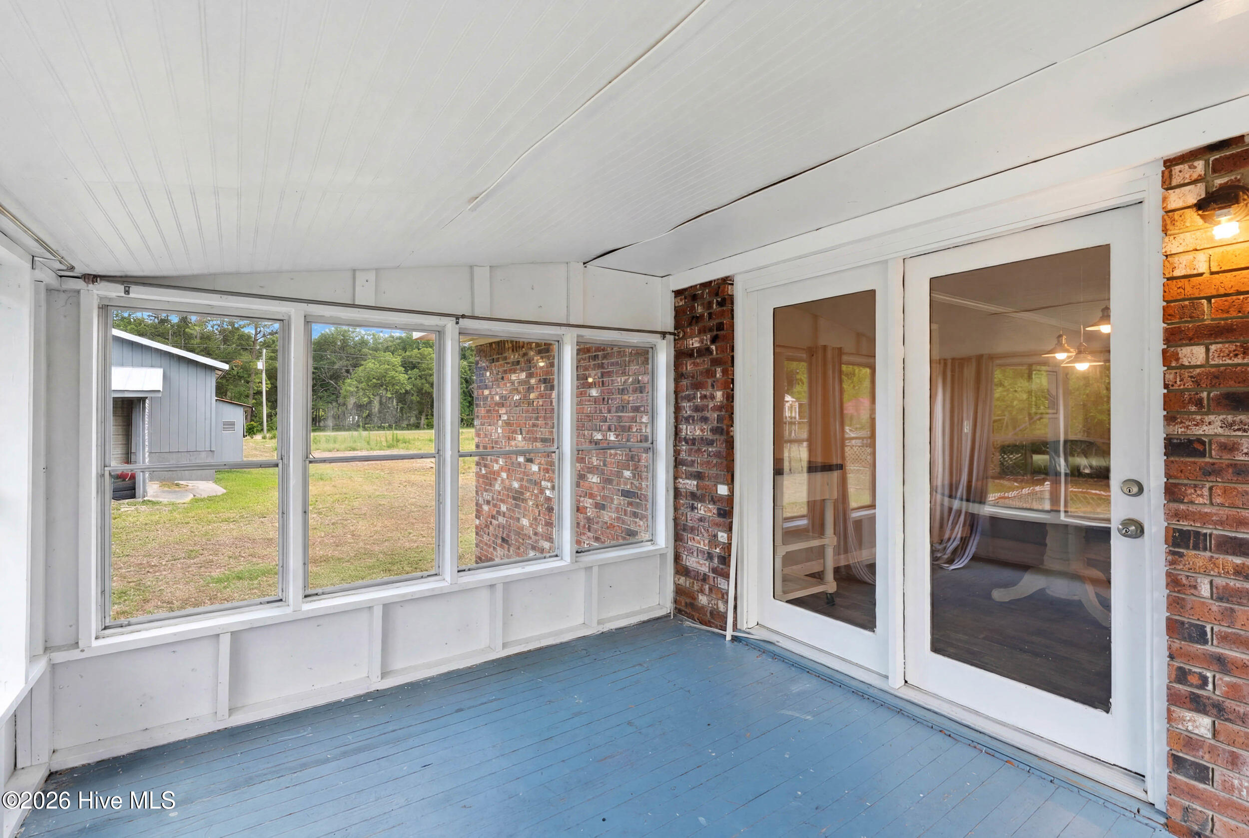 879 Bricklanding Road Southwest Shallotte, NC 28470 - Photo 29 of 56 Screened porch
