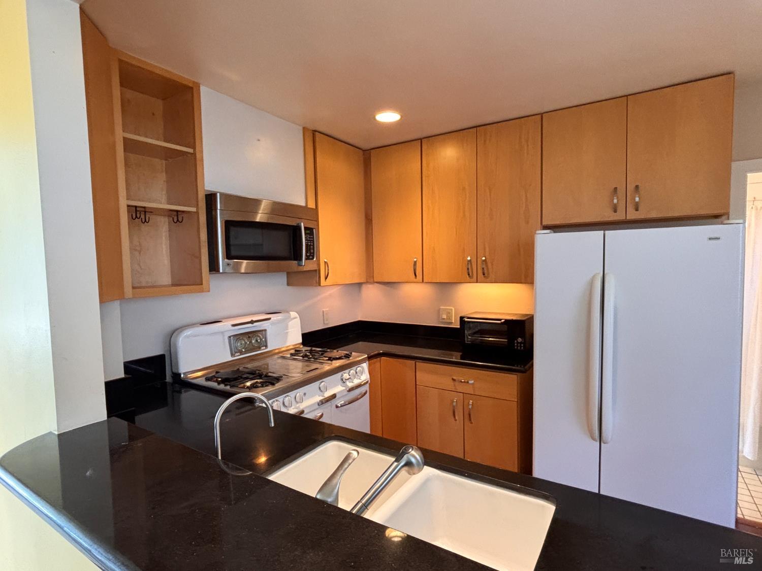 71 Rocca Drive Fairfax, CA 94930 - Photo 4 of 17 a kitchen with a sink a stove and a refrigerator
