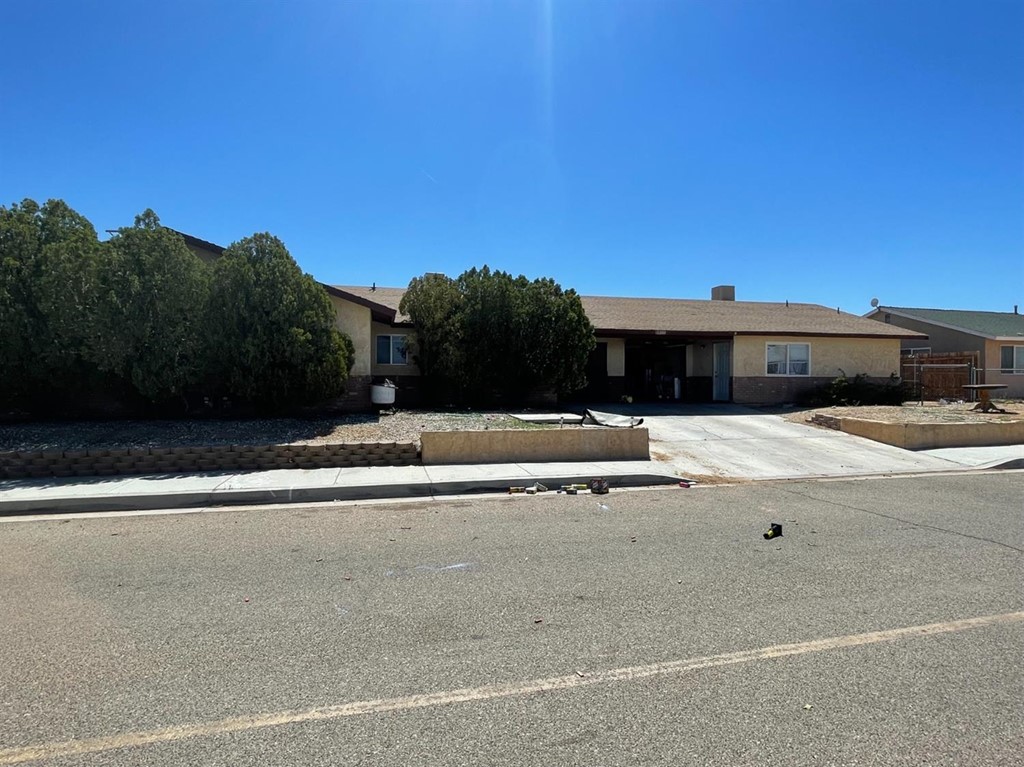 10901 Verbena Road Adelanto, CA 92301 - Photo 1 of 1 a view of swimming pool with a yard