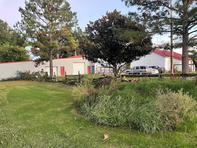 6160 Underwood Road Springfield, TN 37172 - Photo 2 of 21 a sign that is sitting in the grass next to a house
