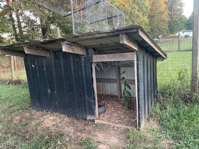 a house with trees in the background