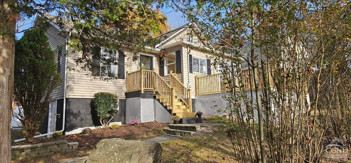 a view of a house with a tree