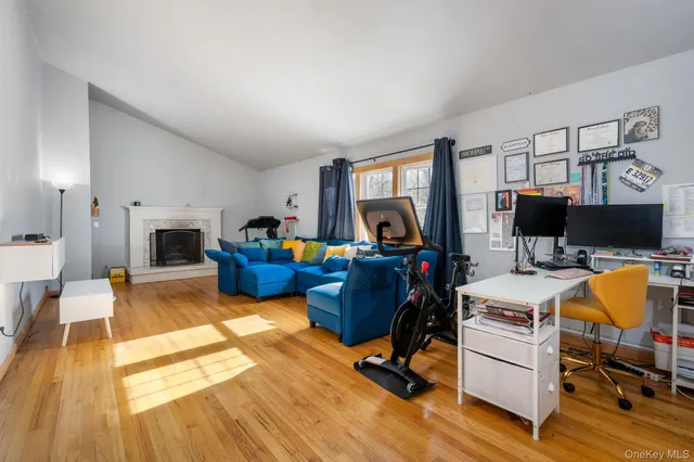 a view of a livingroom with furniture and a flat screen tv