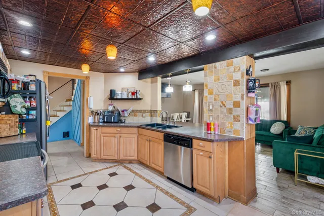 a kitchen with stainless steel appliances granite countertop a sink and cabinets