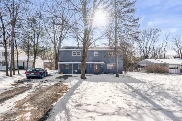 a view of a house with a snow in front of the house