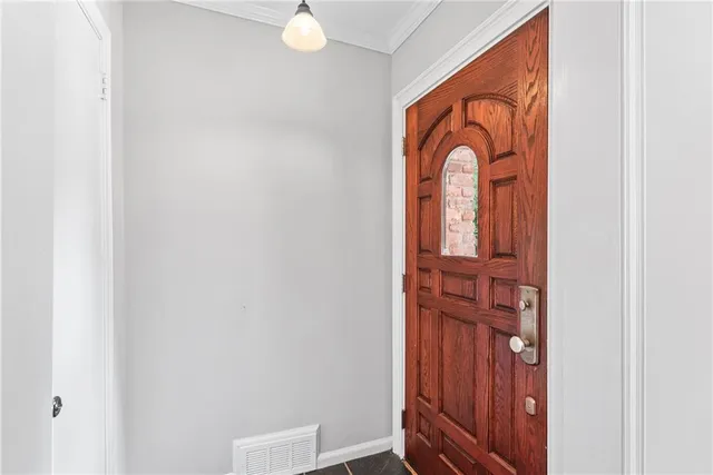 a living room with furniture a flat screen tv and a large window