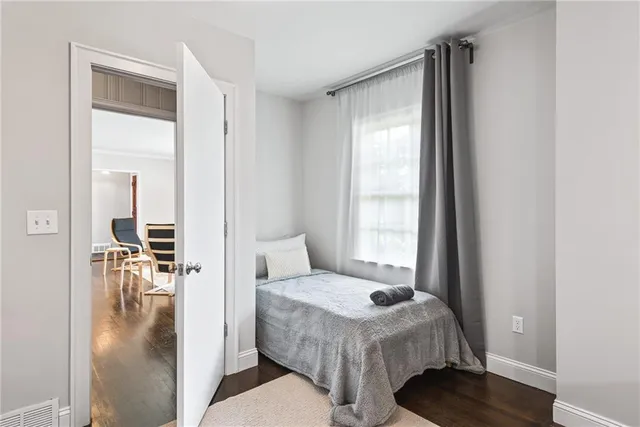 a bedroom with a bed and a table