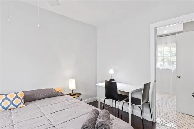 a bathroom with a double vanity sink mirror and shower