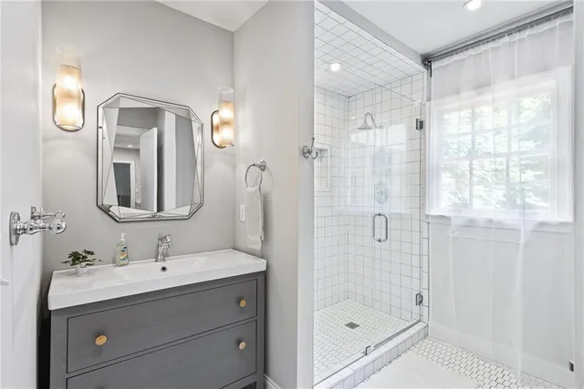 a view of a a dining room with furniture window and wooden floor