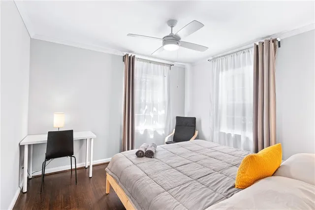 a bedroom with a bed and a table in it