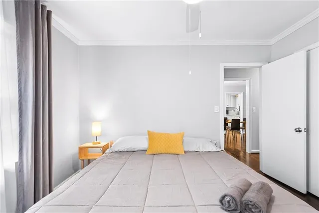 a bedroom with a bed and a lamp