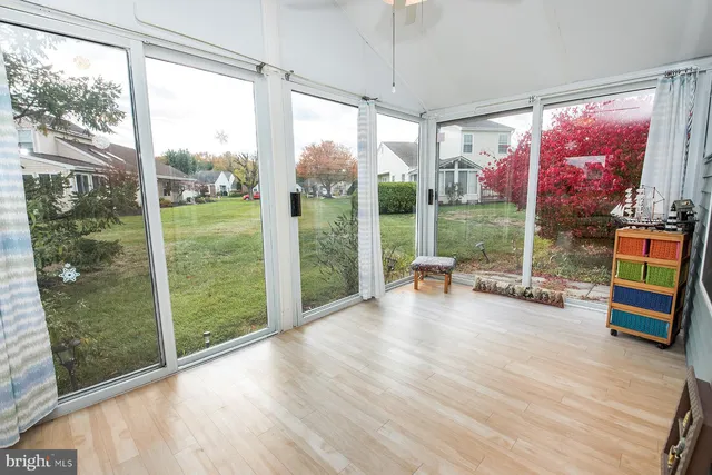 a living room with couch and a large window