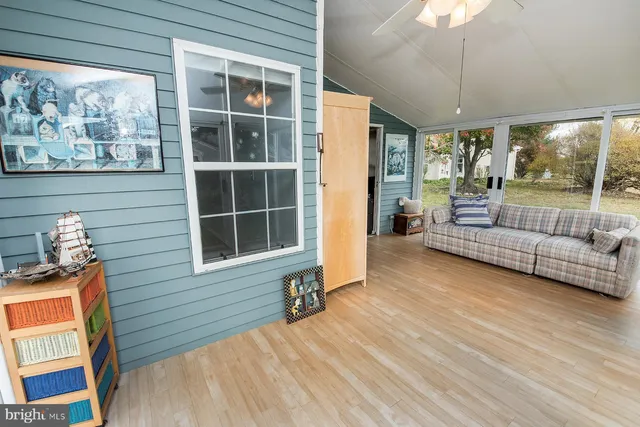 a view of a livingroom with furniture and cabinet