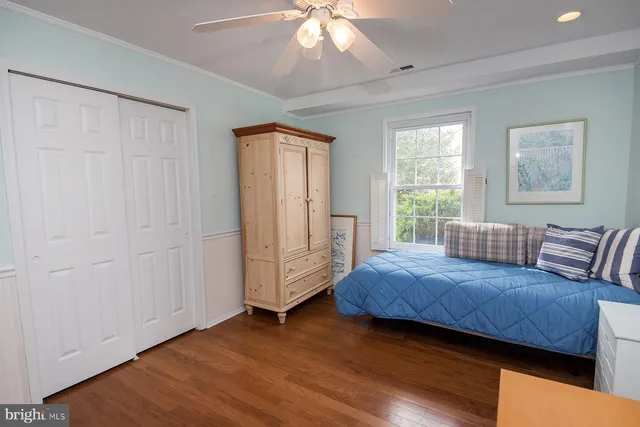 an empty room with wooden floor