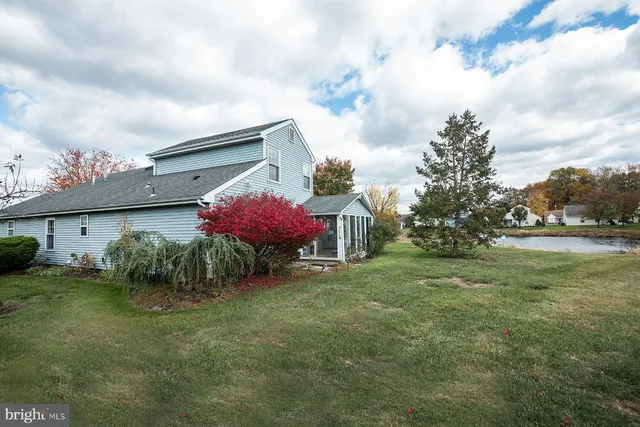 a front view of house with yard and outdoor seating